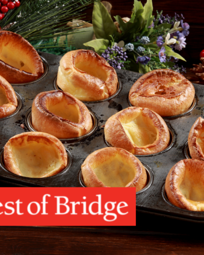 twelve Yorkshire puddings in muffin tin. classic Yorkshire pudding recipe from Best of Bridge