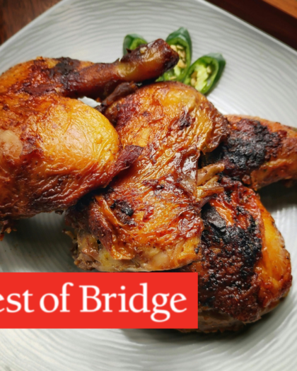 Plate of roasted chicken thighs from Best of Bridge chicken recipes