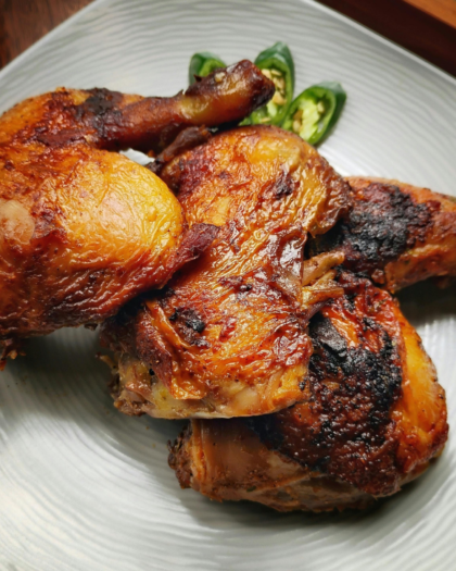 Plate of roasted chicken thighs from Best of Bridge chicken recipes