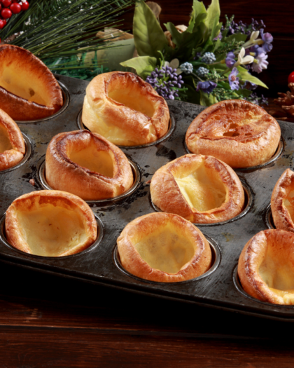 twelve Yorkshire puddings in muffin tin. classic Yorkshire pudding recipe from Best of Bridge